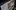 Nahaufnahme auf einen Laptop, auf dem ein Video auf YouTube geöffnet ist. Das Video und der Text selbst sind unscharf, so das hier nichts genaueres zu erkennen ist, lediglich das YouTube Icon oben links ist klar zu erkennen.